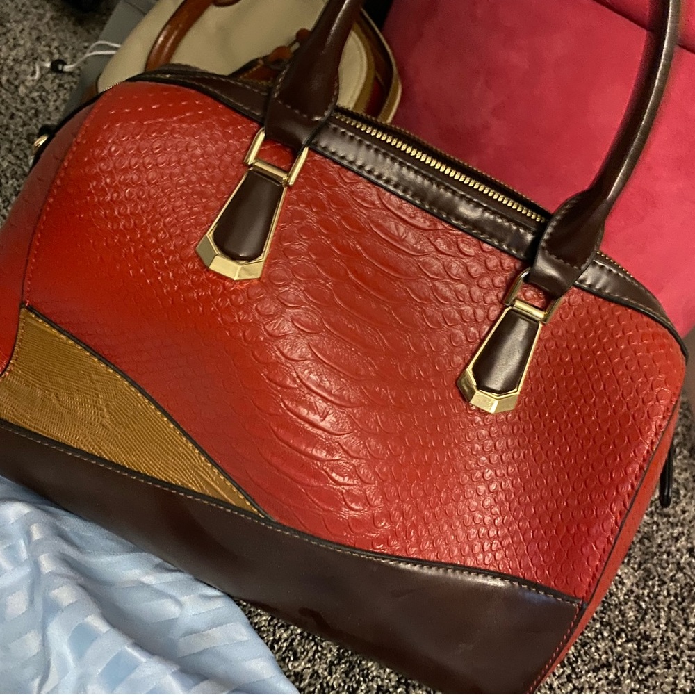 Red tan and brown purse with matching wallet